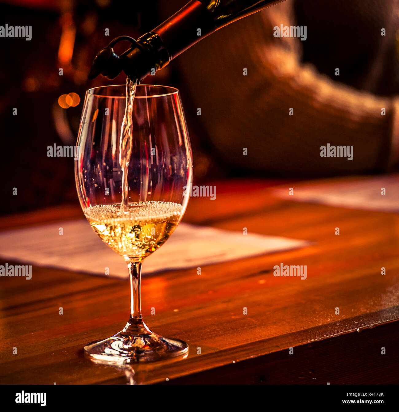 USA, Washington State, Woodinville. White wine pouring at Armstrong