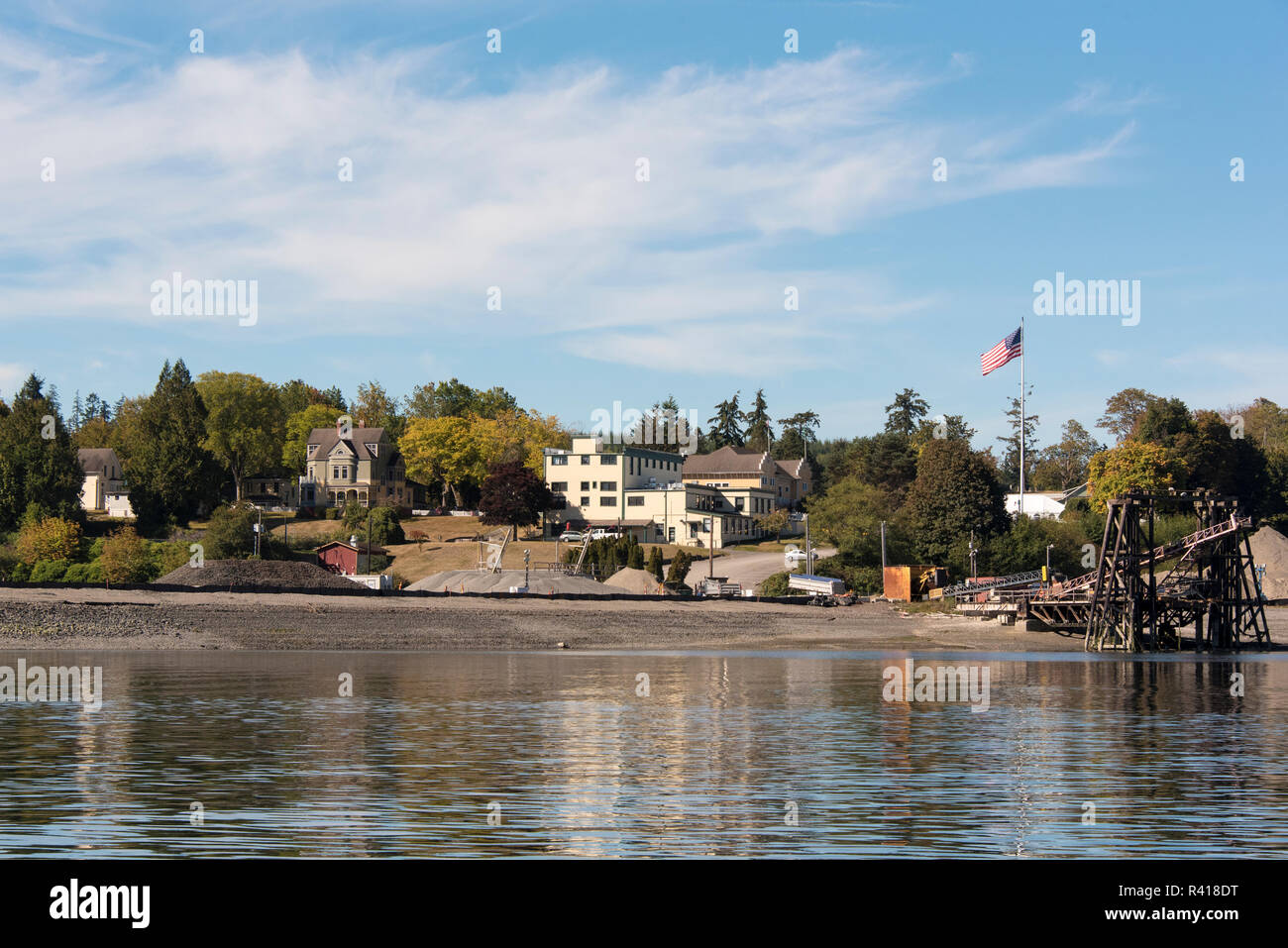 USA, Washington State, Kitsap Peninsula. Port Gamble constructing marina. General Store and Walker-Ames House just beyond Stock Photo