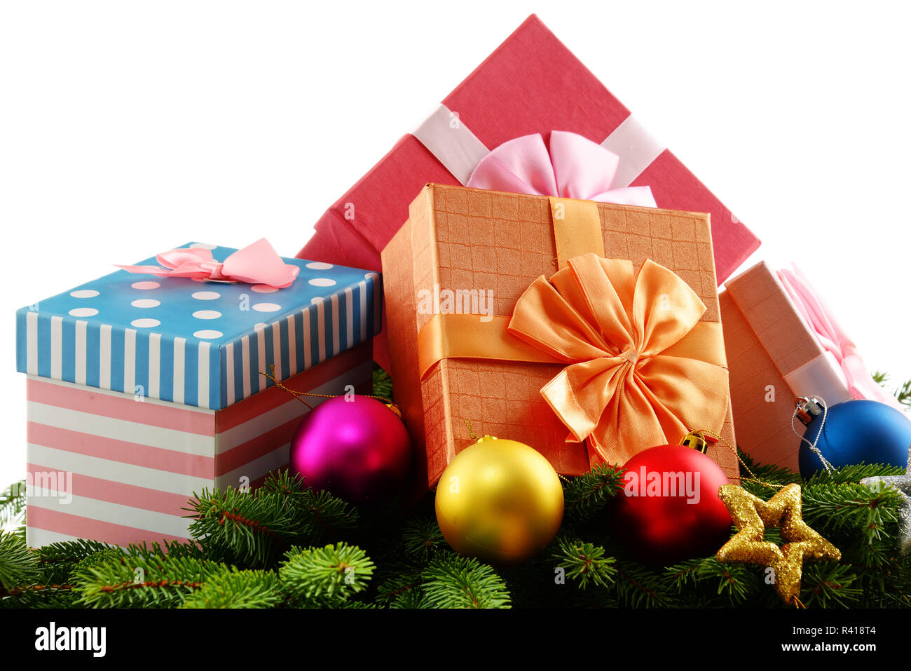 Colorful gift boxes and christmas tree isolated on white Stock Photo