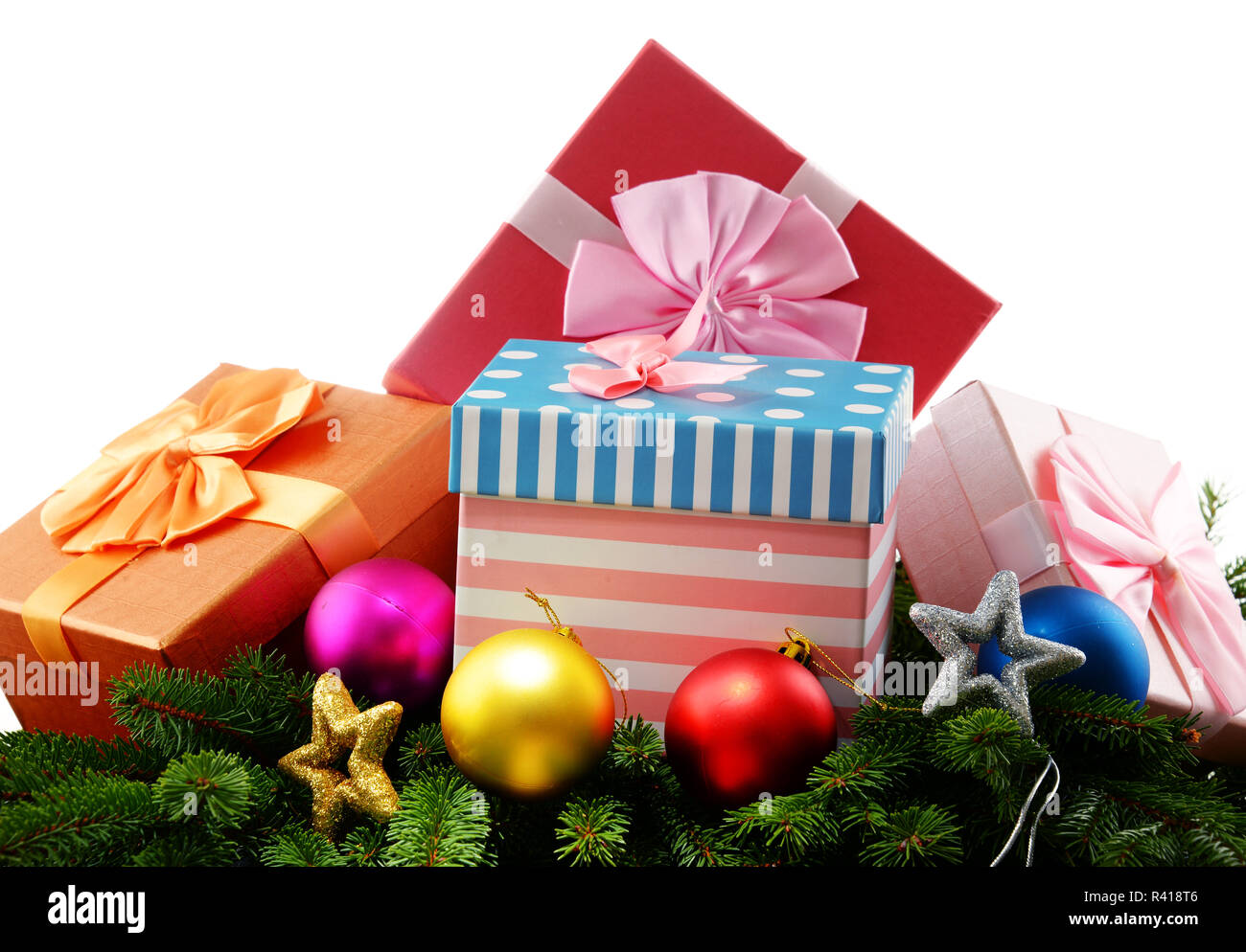 Colorful gift boxes and christmas tree isolated on white Stock Photo