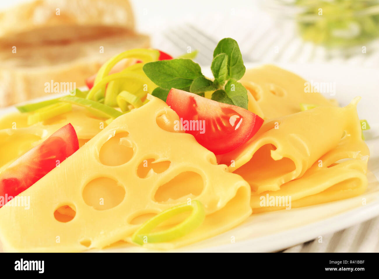 Thinsliced Swiss cheese Stock Photo Alamy