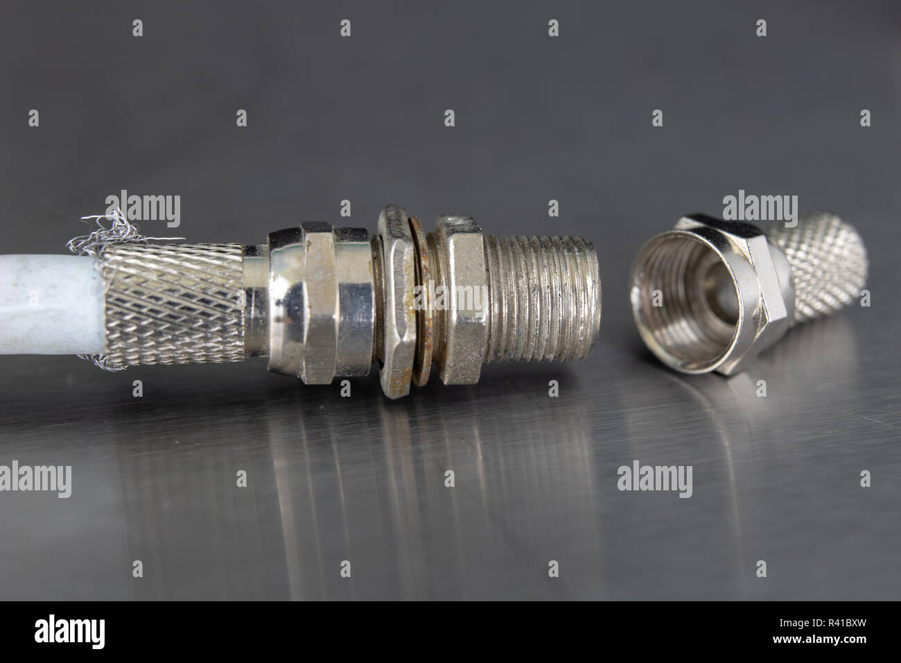 Antenna and television connectors on a metal table. Accessories for ...
