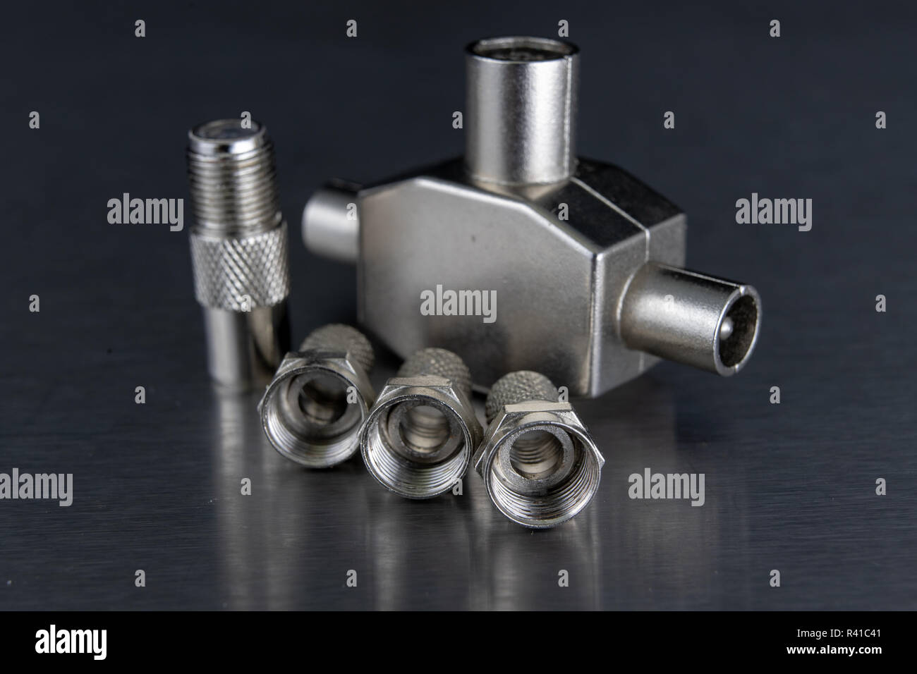 Antenna and television connectors on a metal table. Accessories for ...
