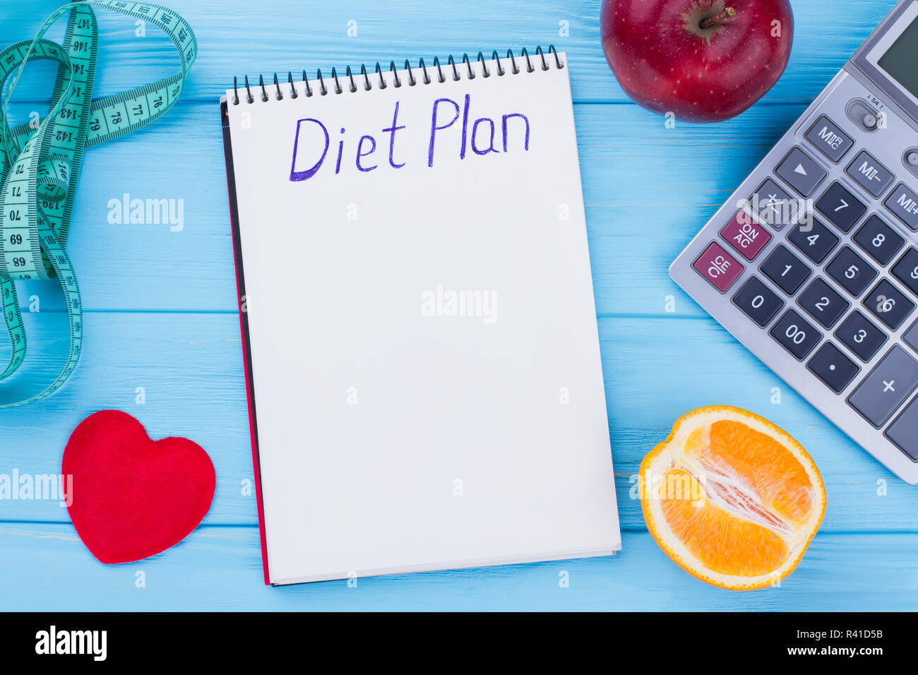 Lowcalorie fruit diet. Fruits, measuring tape, calculator and paper