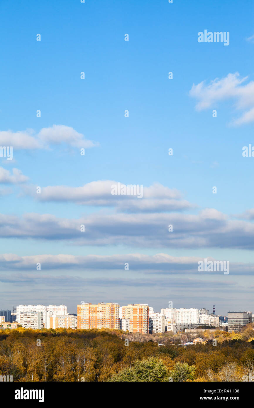 blue sky with clouds over city and woods in autumn Stock Photo - Alamy
