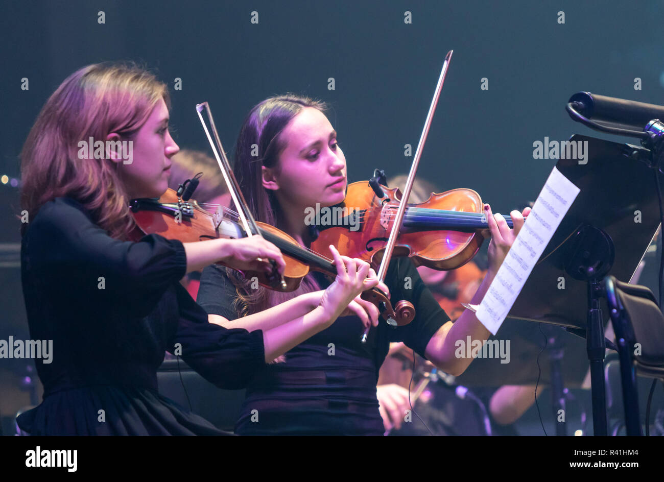 KYIV, UKRAINE - NOVEMBER 22, 2018: Violinists of Symphony Orchestra (conductor Andrey Chernyi) perform on stage during 'The Game of Thrones' concert a Stock Photo