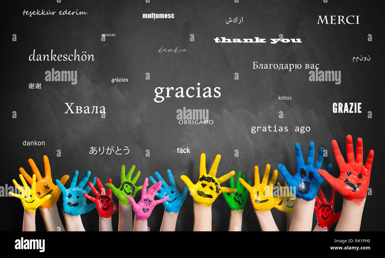 painted kids hands in front of a blackboard with the message "thank you ...