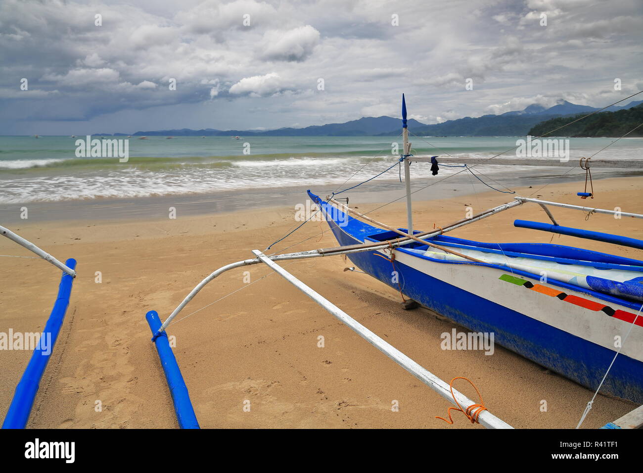 Fishing bangka boats stranded on the beach. Sabang-P.P.Subterranean River Nnal.Park-Palawan-Philippines-079 Stock Photo