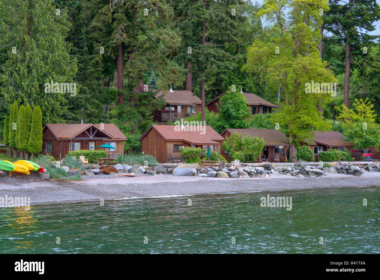 USA, Washington State, San Juan Islands, Orcas Island, Cabins and beach at West Beach Resort. Stock Photo