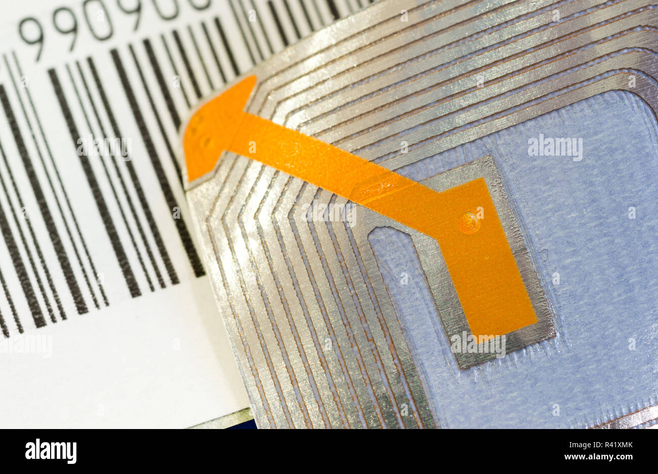 Close up of RFID tags ana a code bar used for tracking and identification purposes and as an anti-theft system in commerce and retail. Stock Photo