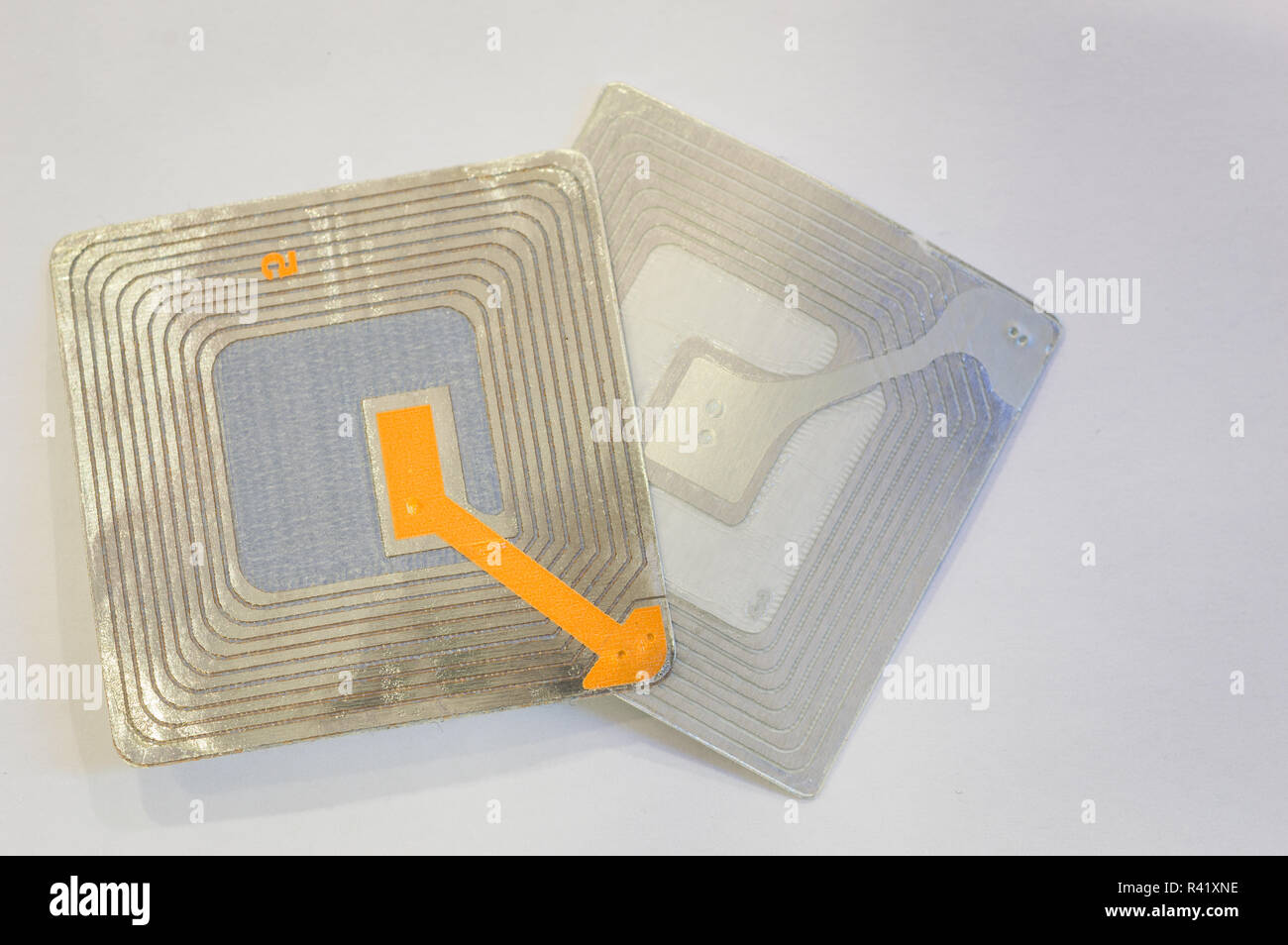 Close up of several RFID tags used for tracking and identification purposes and as an anti-theft system in commerce and retail. Stock Photo