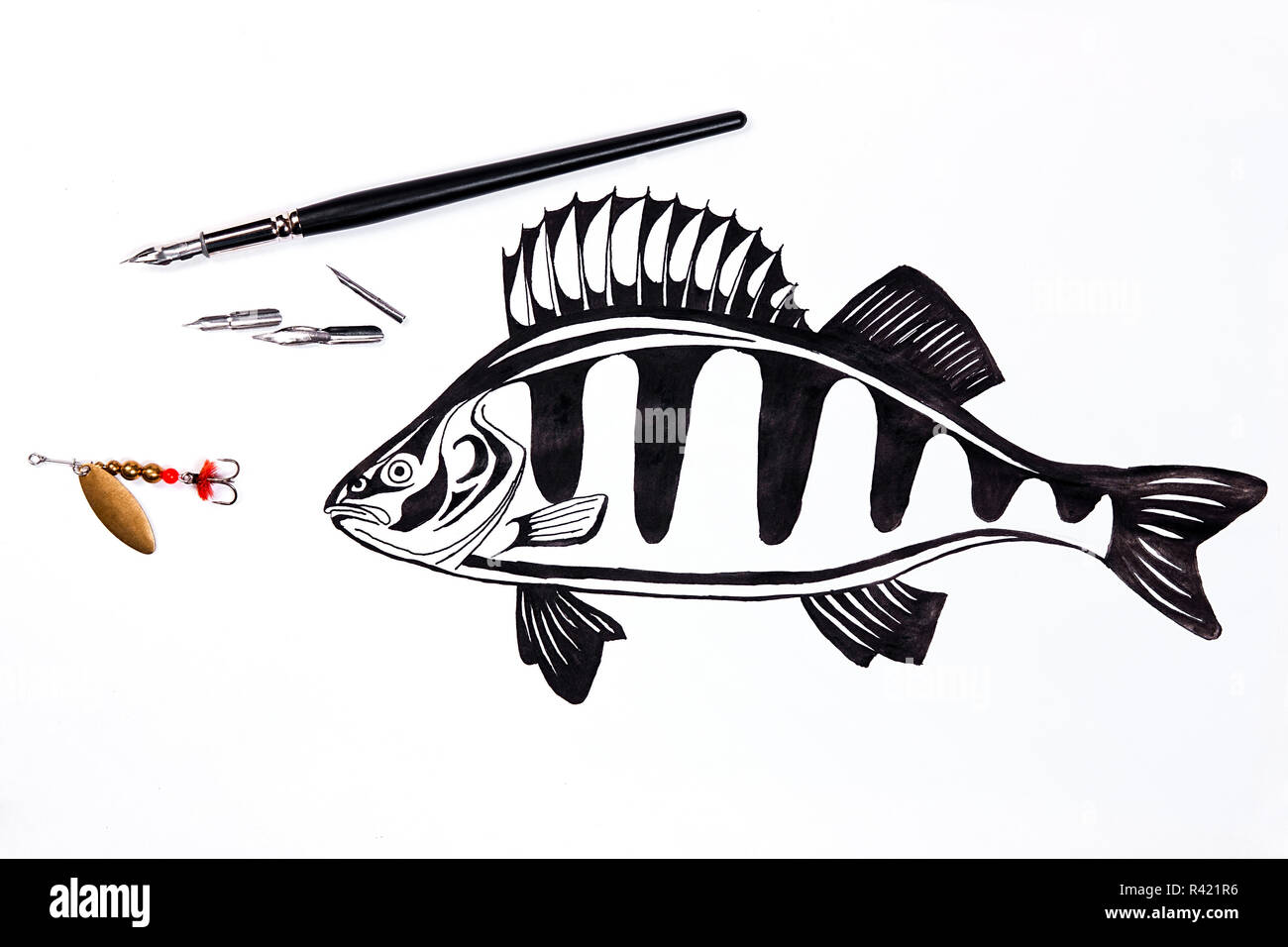Fishing metal bait and fountain pen with ink drawing fish. Stock Photo