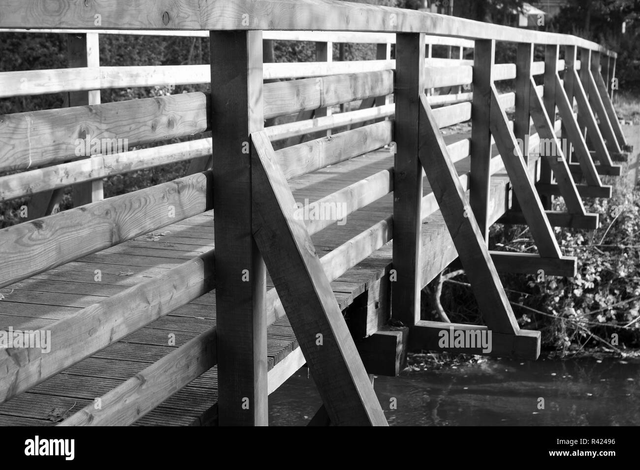long wooden bridge on a river Stock Photo Alamy