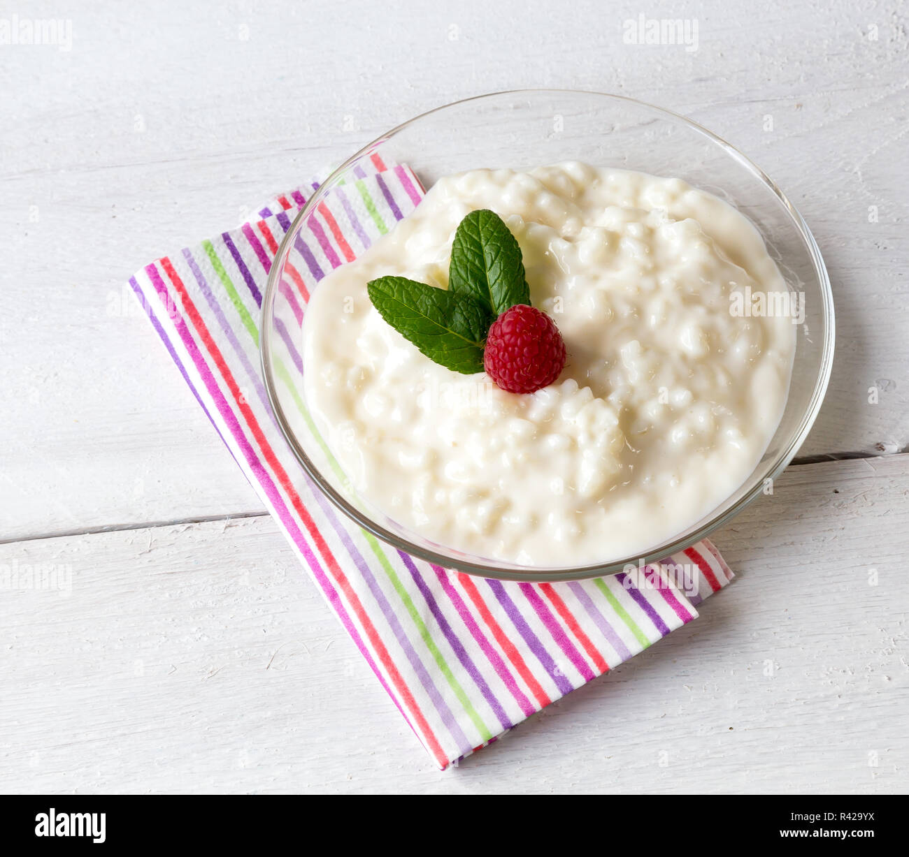 rice pudding with mint and raspberry Stock Photo - Alamy
