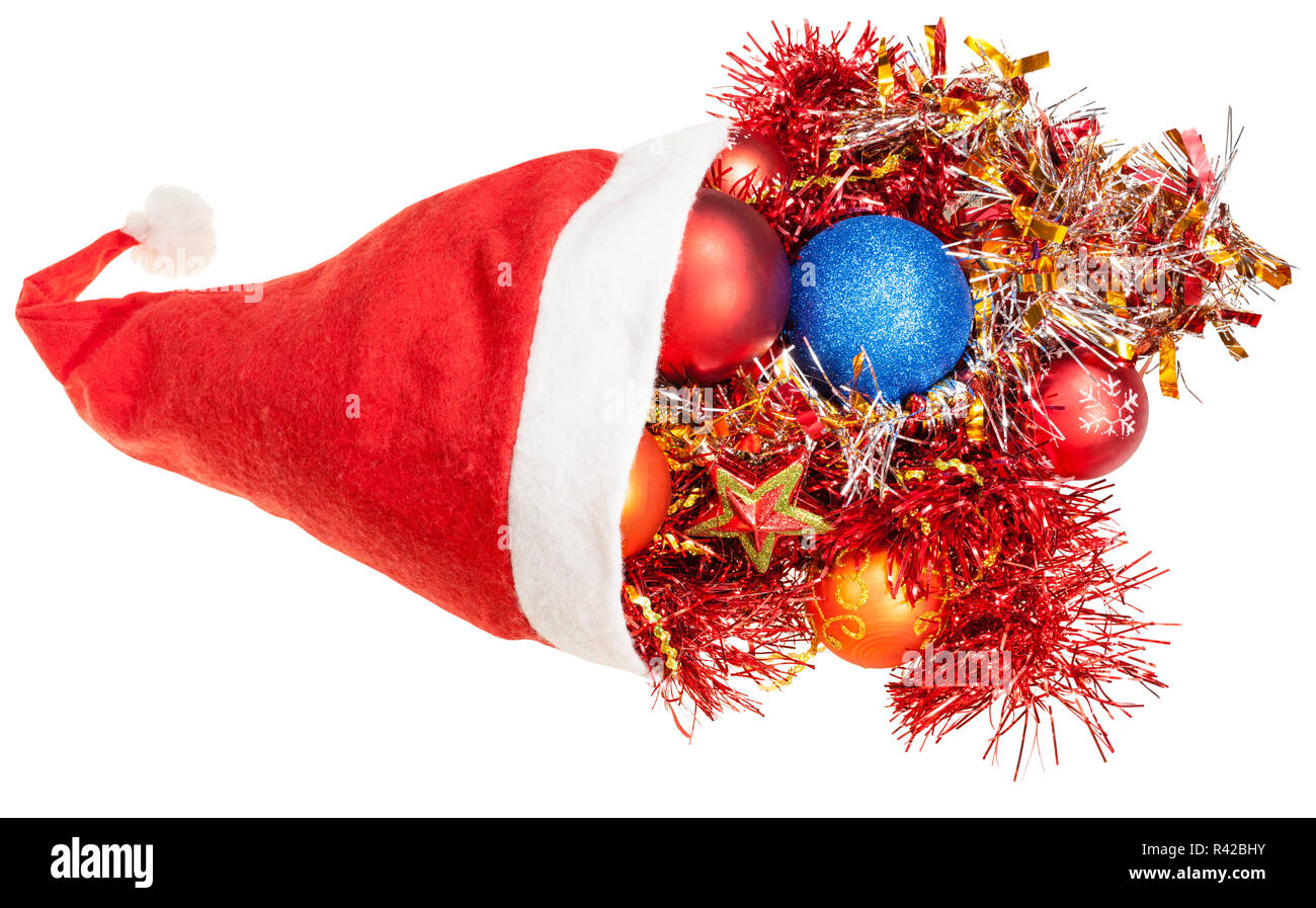 xmas decoration and tinsel pour out from santa hat Stock Photo Alamy