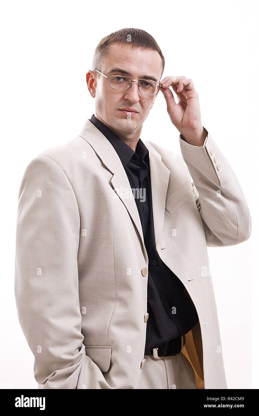 Portrait of man in white suit wearing glasses Stock Photo - Alamy