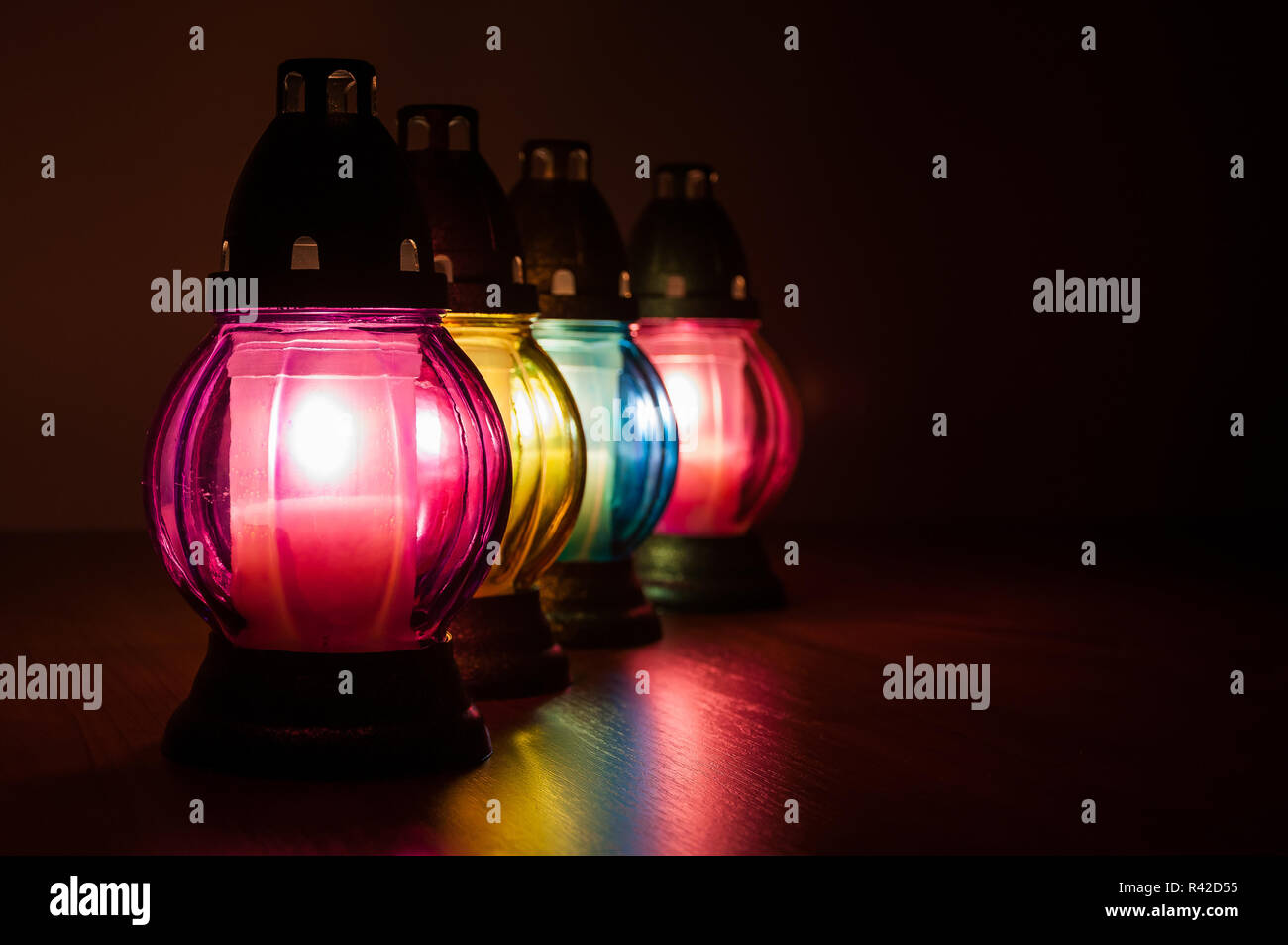 burning votive candles in the dark Stock Photo Alamy