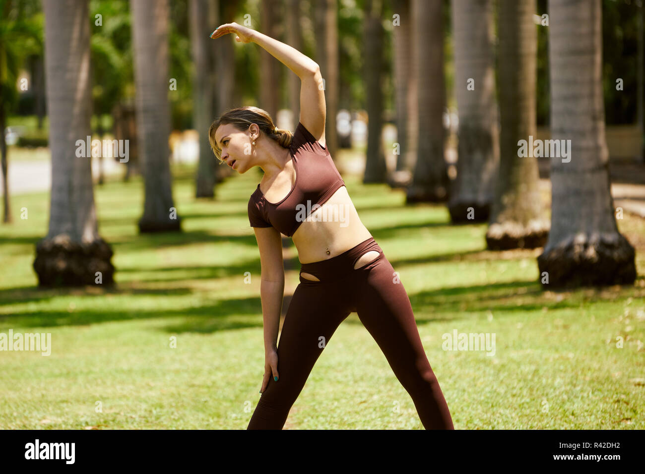 Woman Doing Stretching Before Sports Training At Morning-2 Stock Photo