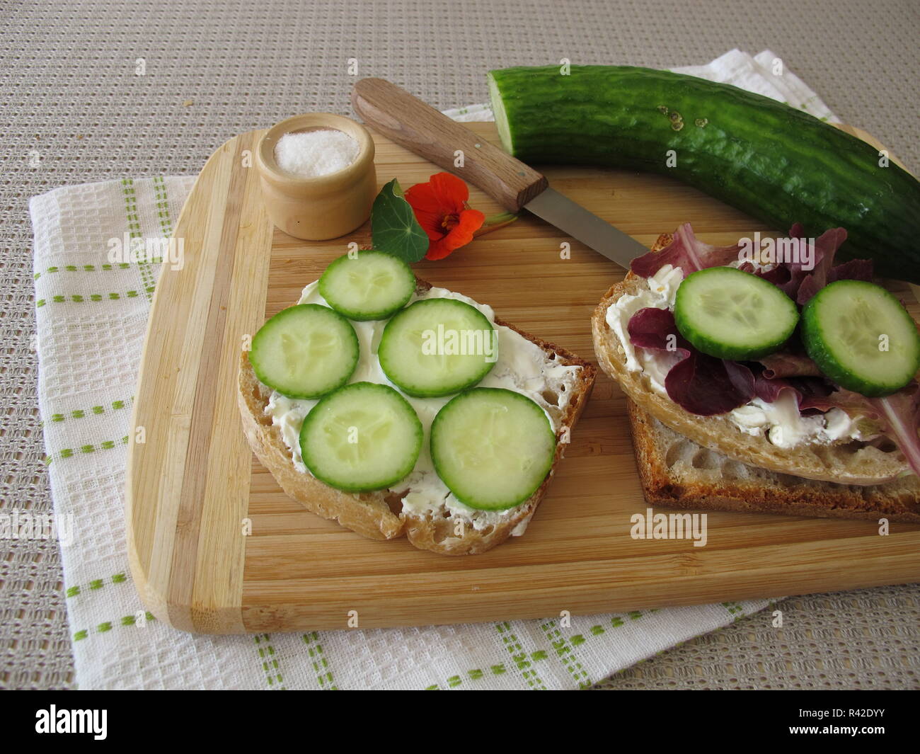 break bread with cream cheese,cucumber and lettuce leaf Stock Photo Alamy