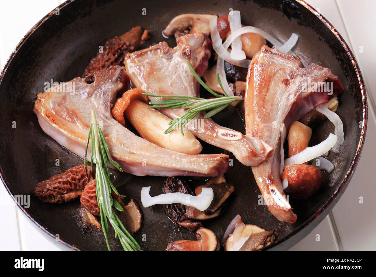 Pan-roasted lamb chops and mushrooms Stock Photo - Alamy