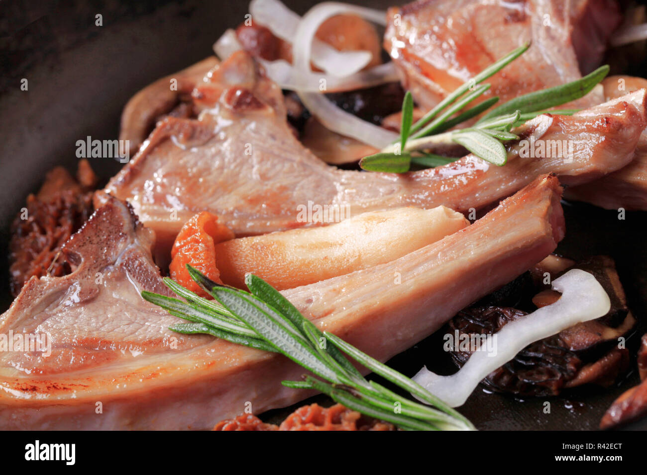 Pan-roasted lamb chops and mushrooms Stock Photo - Alamy