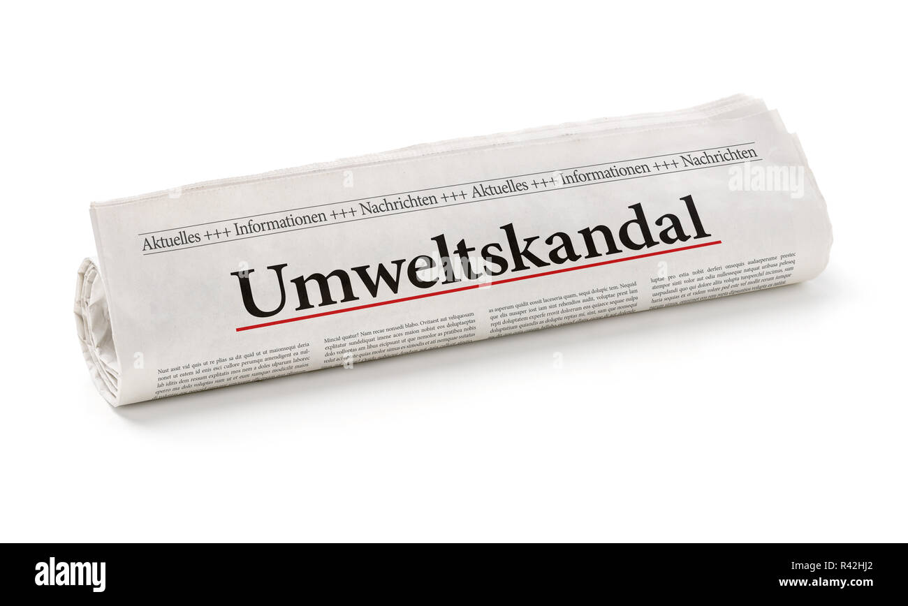 newspaper roll with the heading environmental scandal Stock Photo