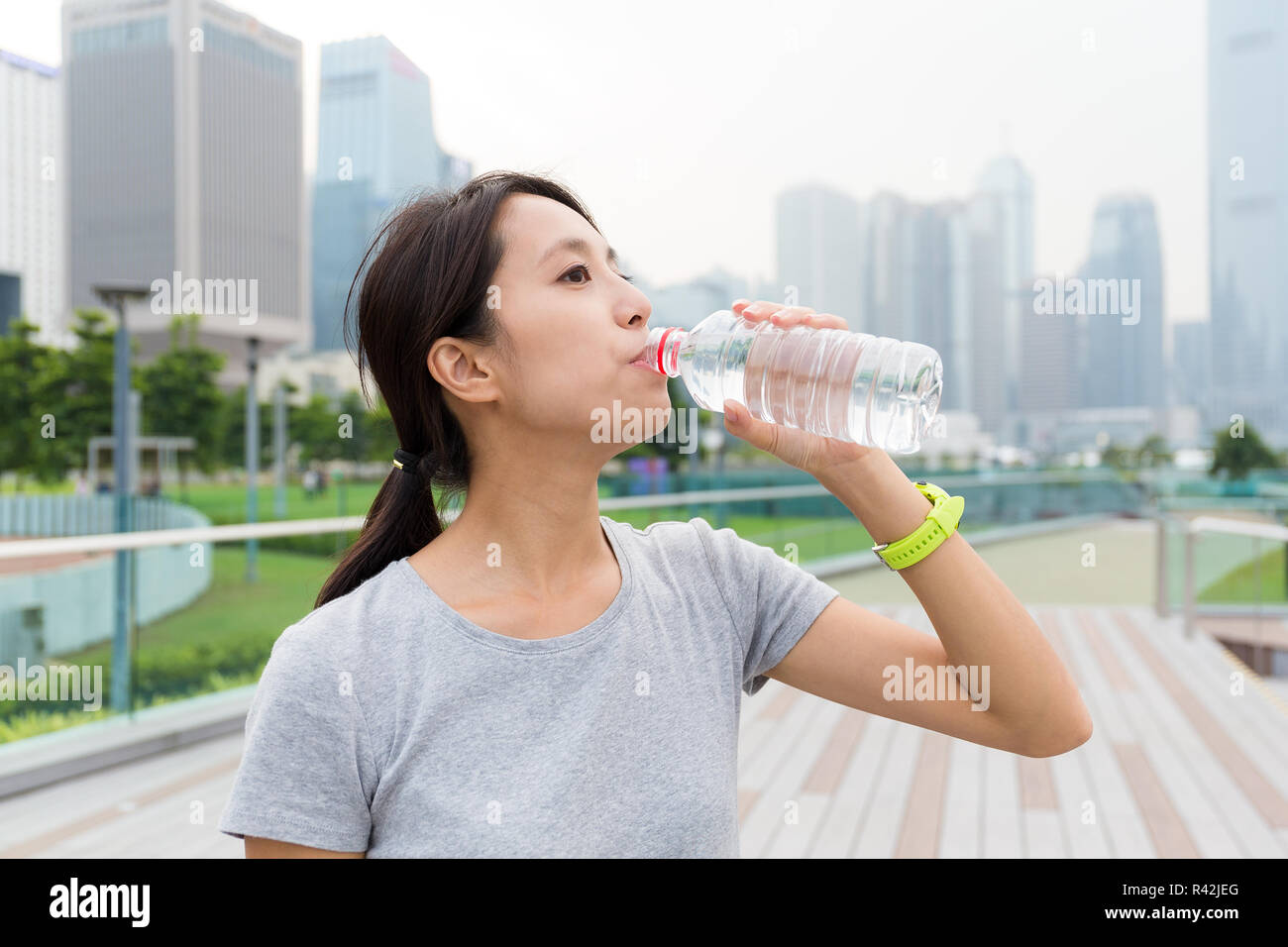 Sport woman drink water after running Stock Photo Alamy