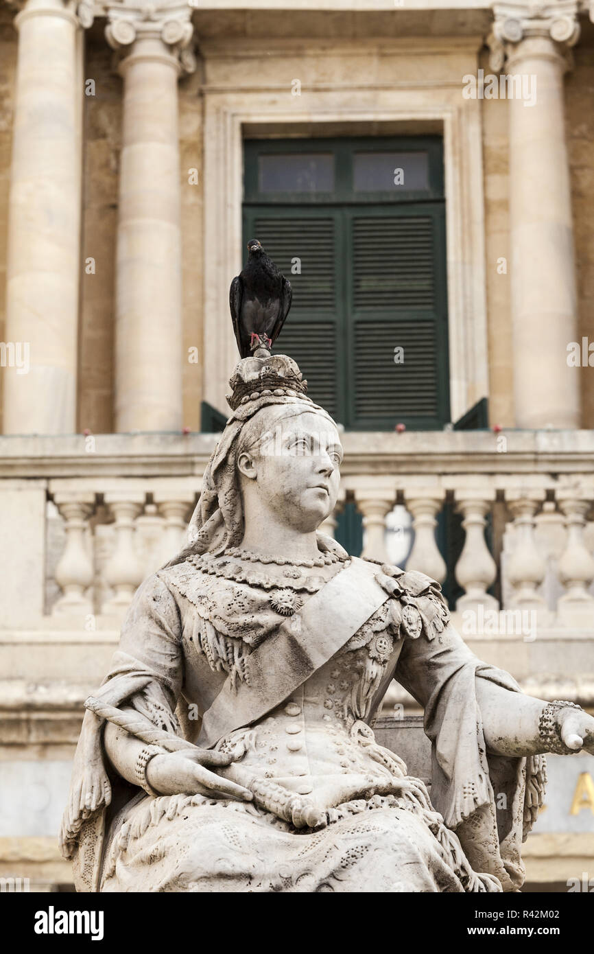 sculpture of Queen Victoria with pigeon in capital of Malta Valletta