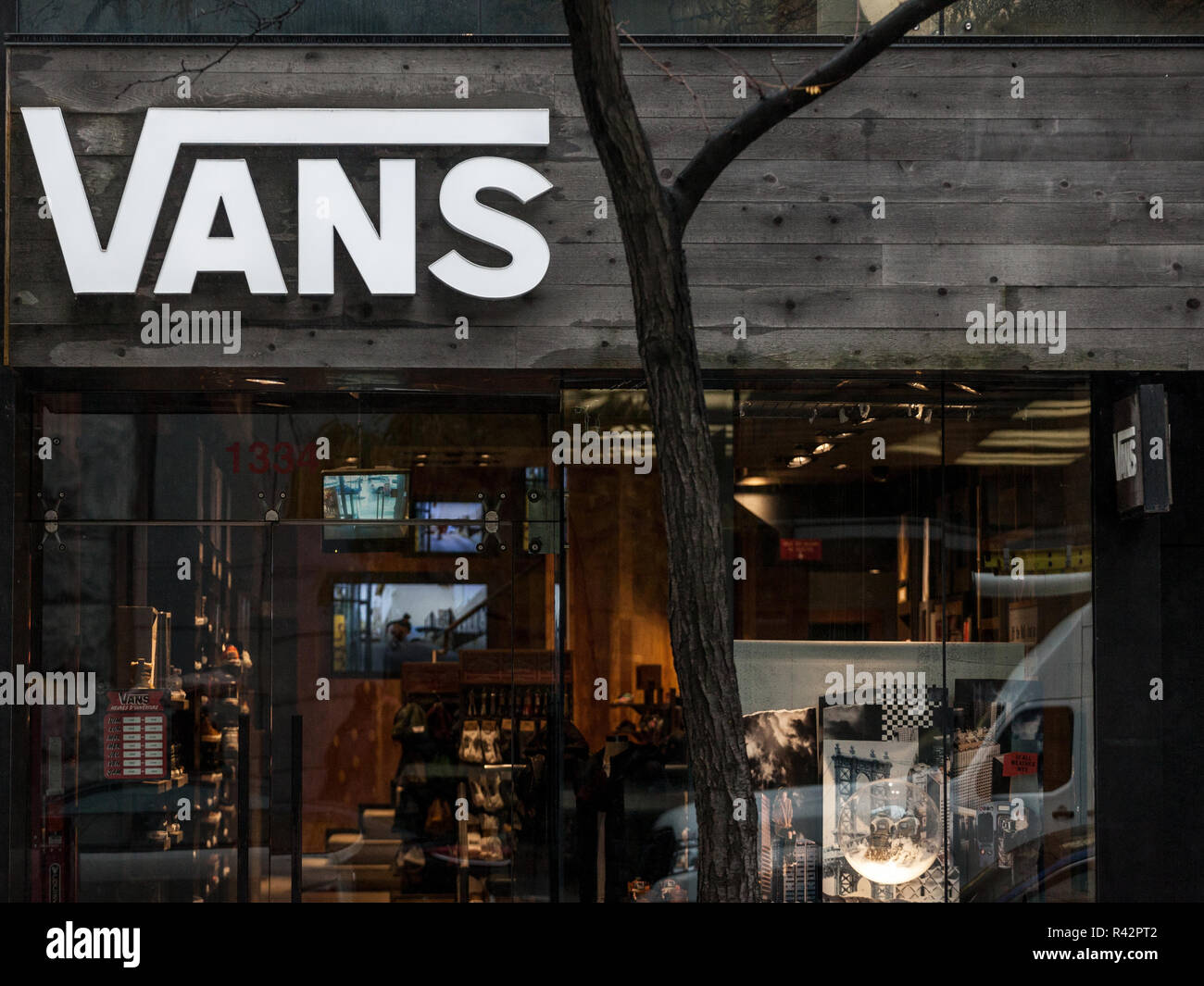 MONTREAL, CANADA - NOVEMBER 5, 2018: Vans logo on their main shop for Montreal, Quebec. Vans is an american footwear, shoes and apparel company specia Stock Photo