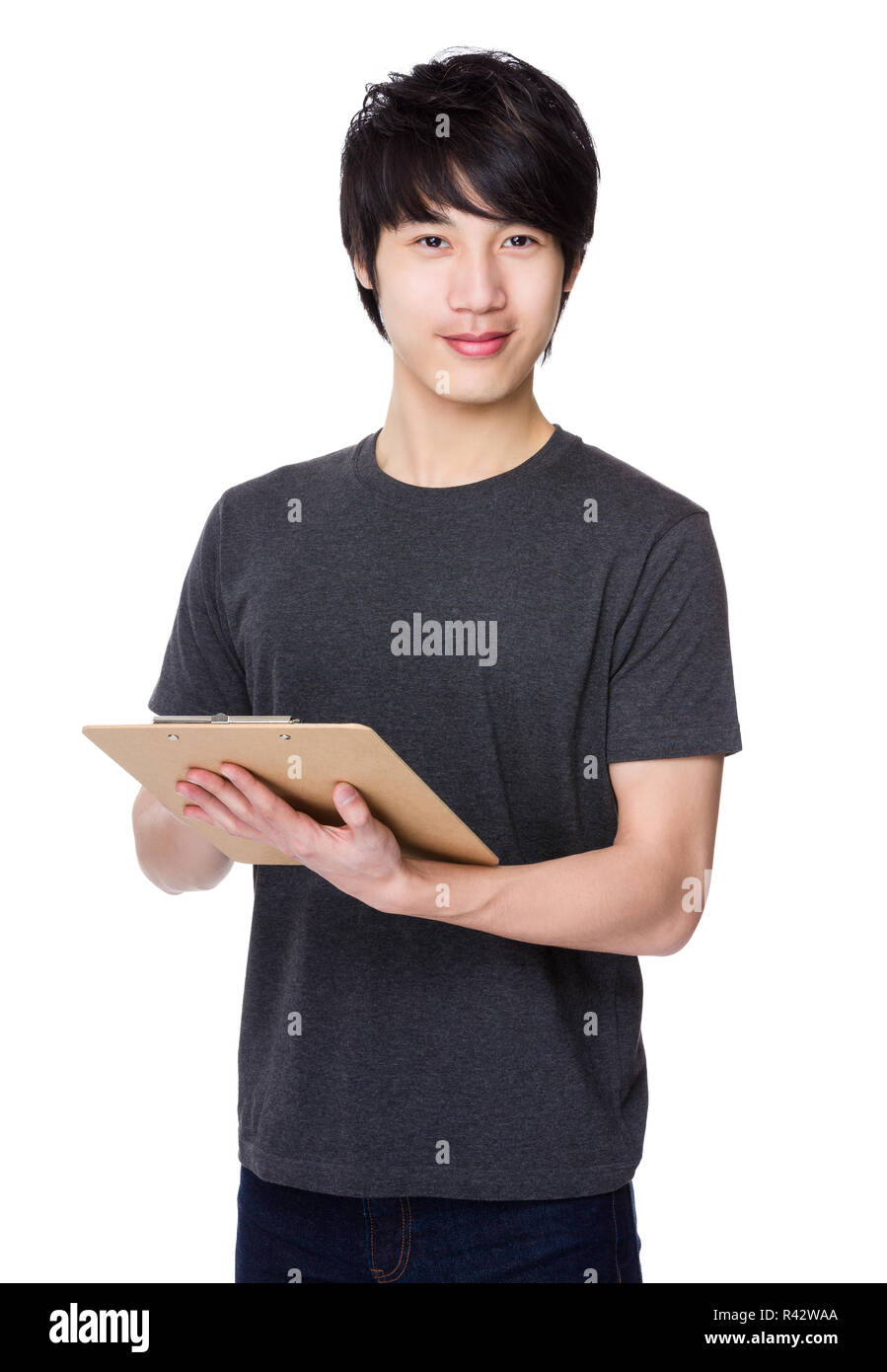 Man take note on clipboard Stock Photo - Alamy