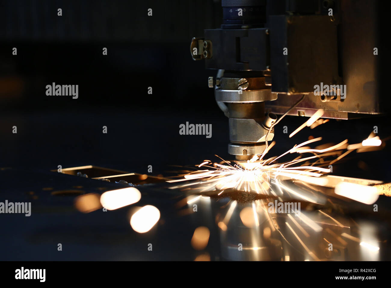 Sparks fly out machine head for metal processing Stock Photo