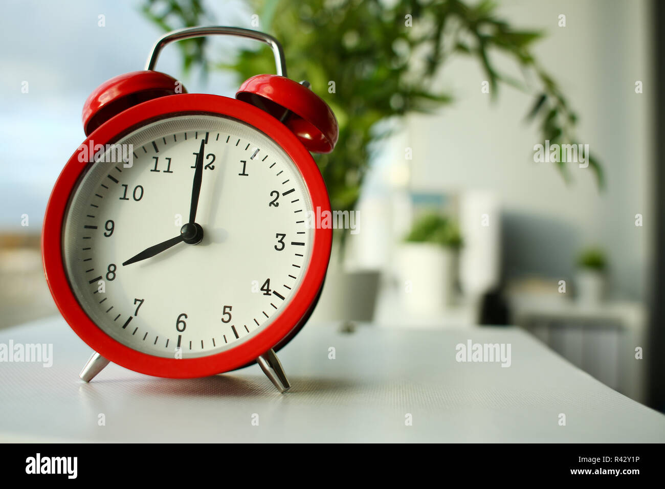 Red alarm clock set at seven in the morning Stock Photo - Alamy