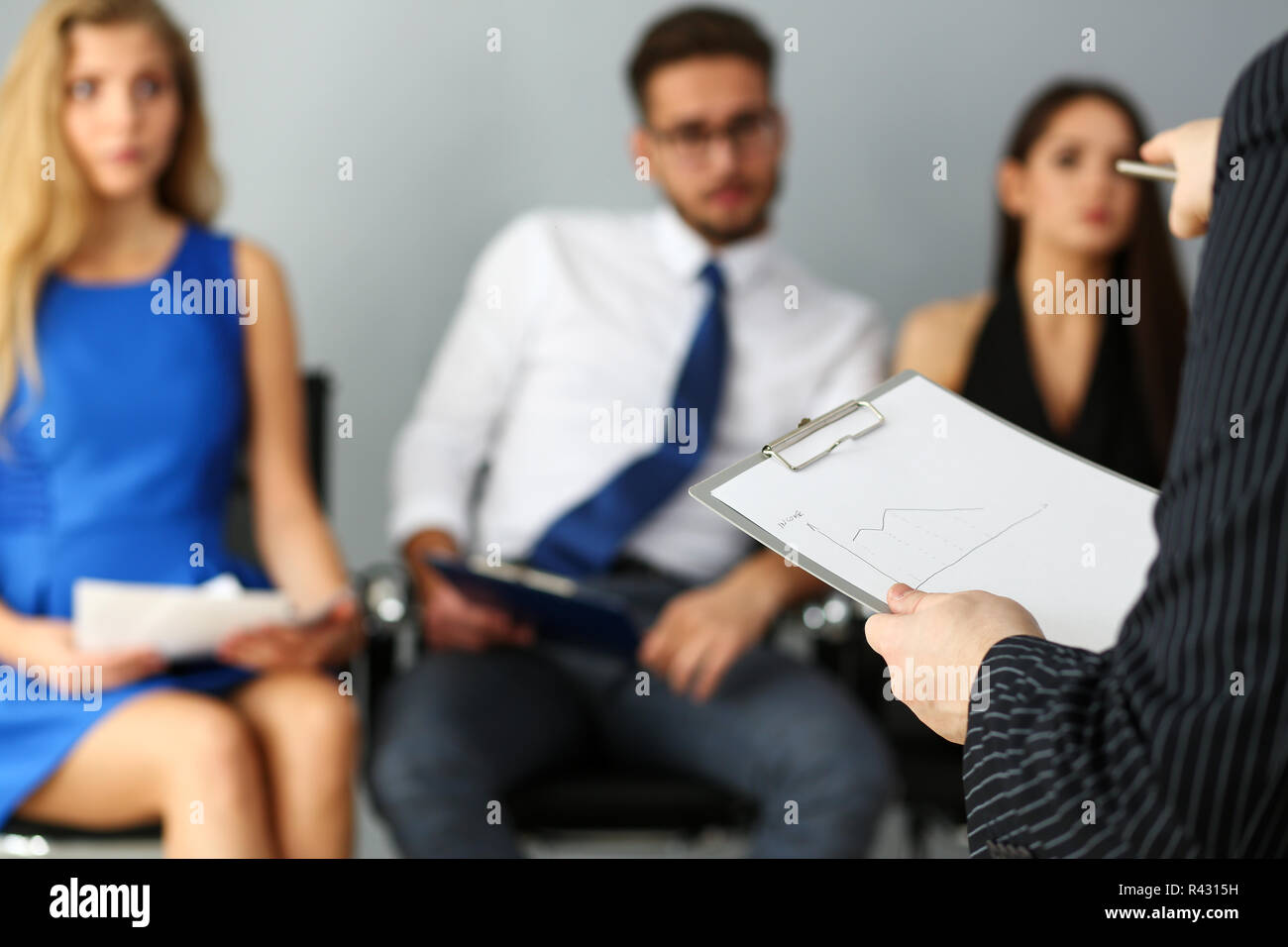 Group of people sit on casting chairs row at boss reception Stock Photo ...