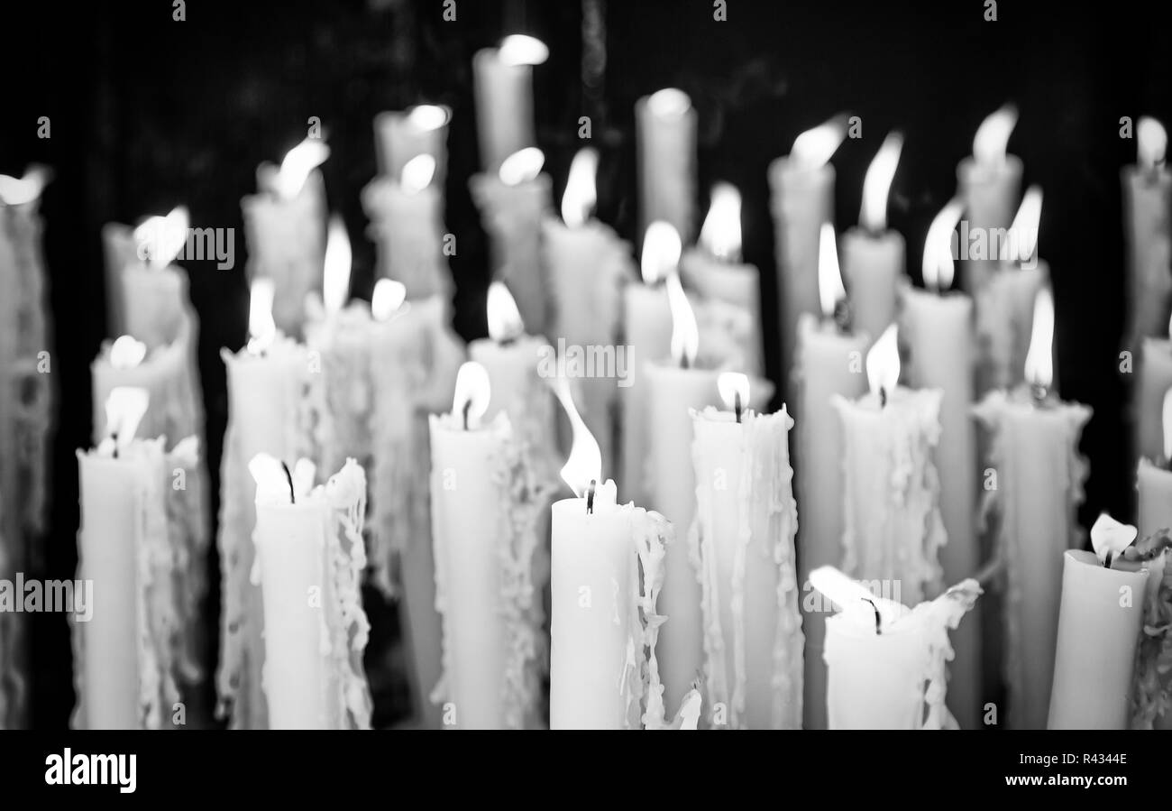 Wax candles to pray, detail of a religious tradition, belief and faith