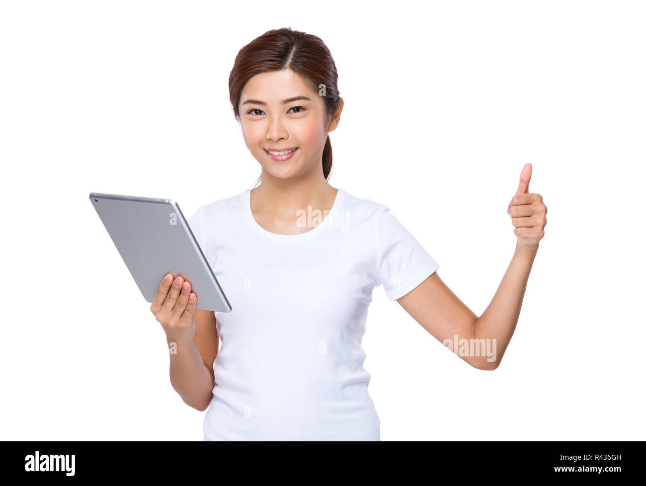 Asian woman use of tablet pc and thumb up Stock Photo - Alamy