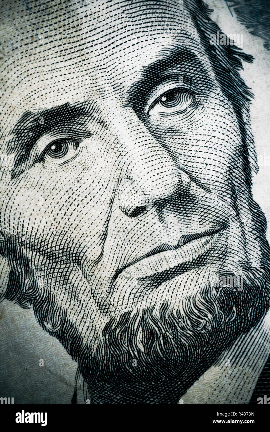 Extreme closeup of Abraham Lincoln on a five dollar bill. Stock Photo