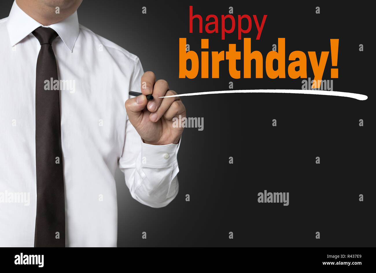 happy birthday is written by businessman background concept Stock Photo