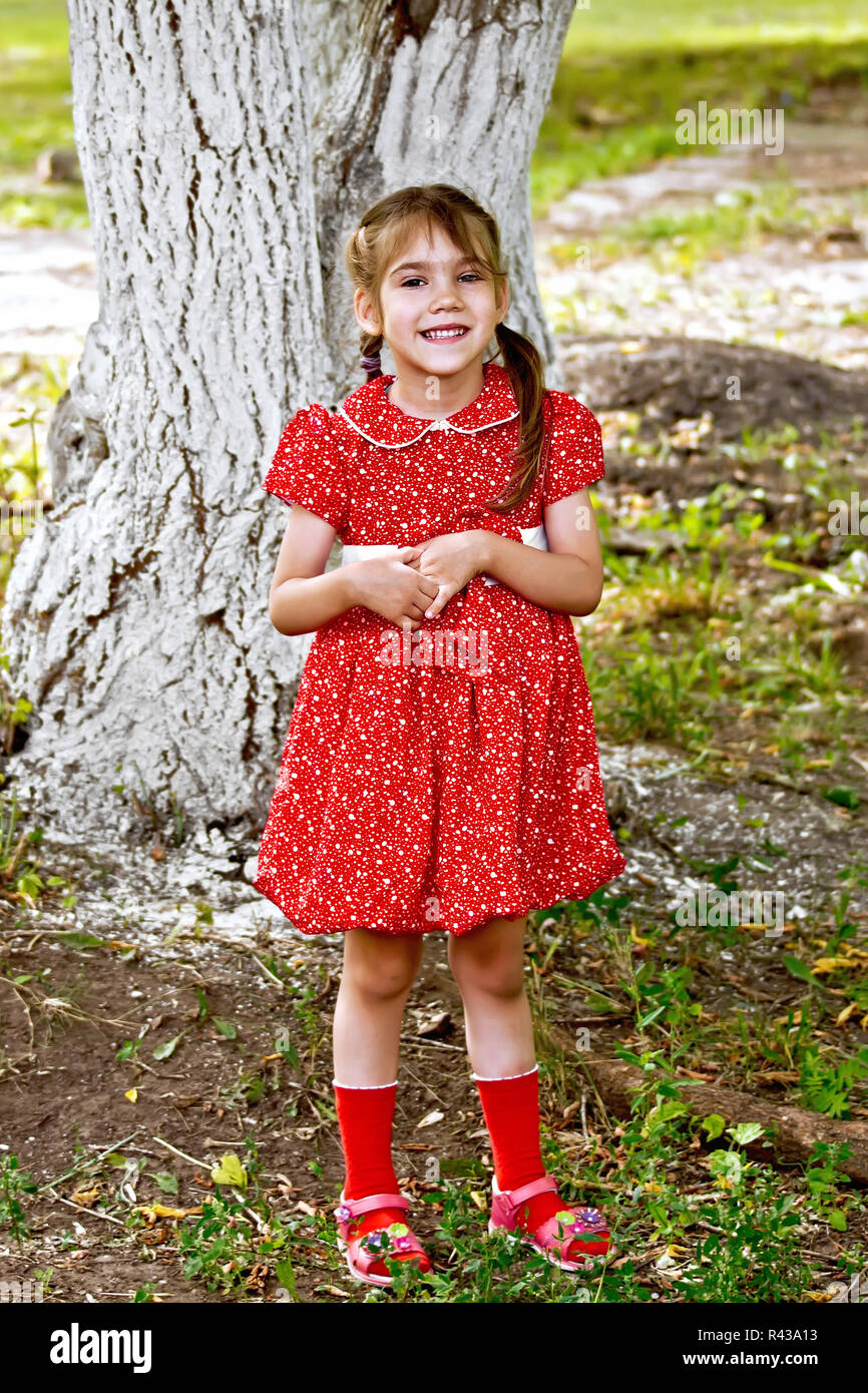 Girl in red dress Stock Photo - Alamy