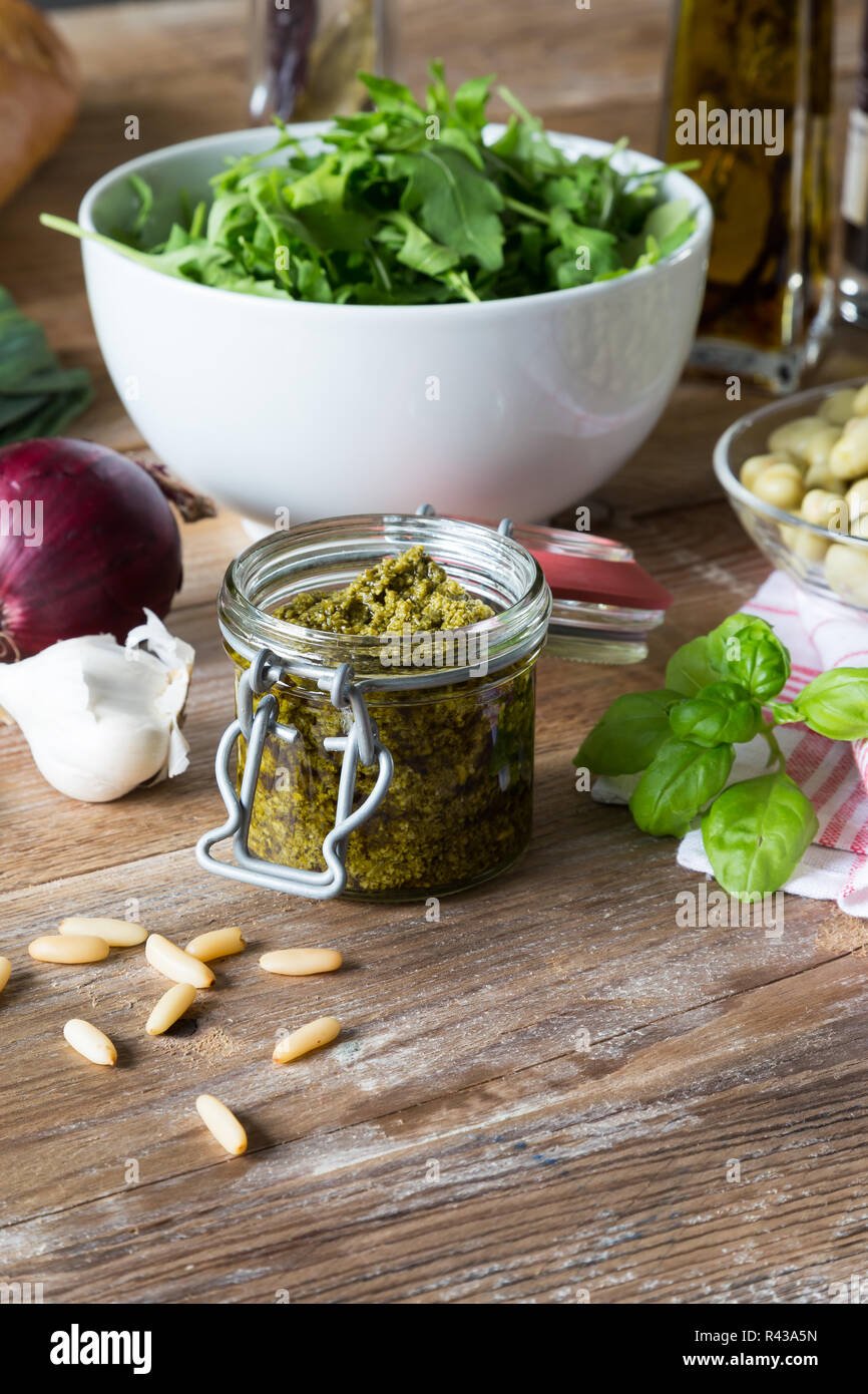 pesto in a jar with ingredients Stock Photo Alamy
