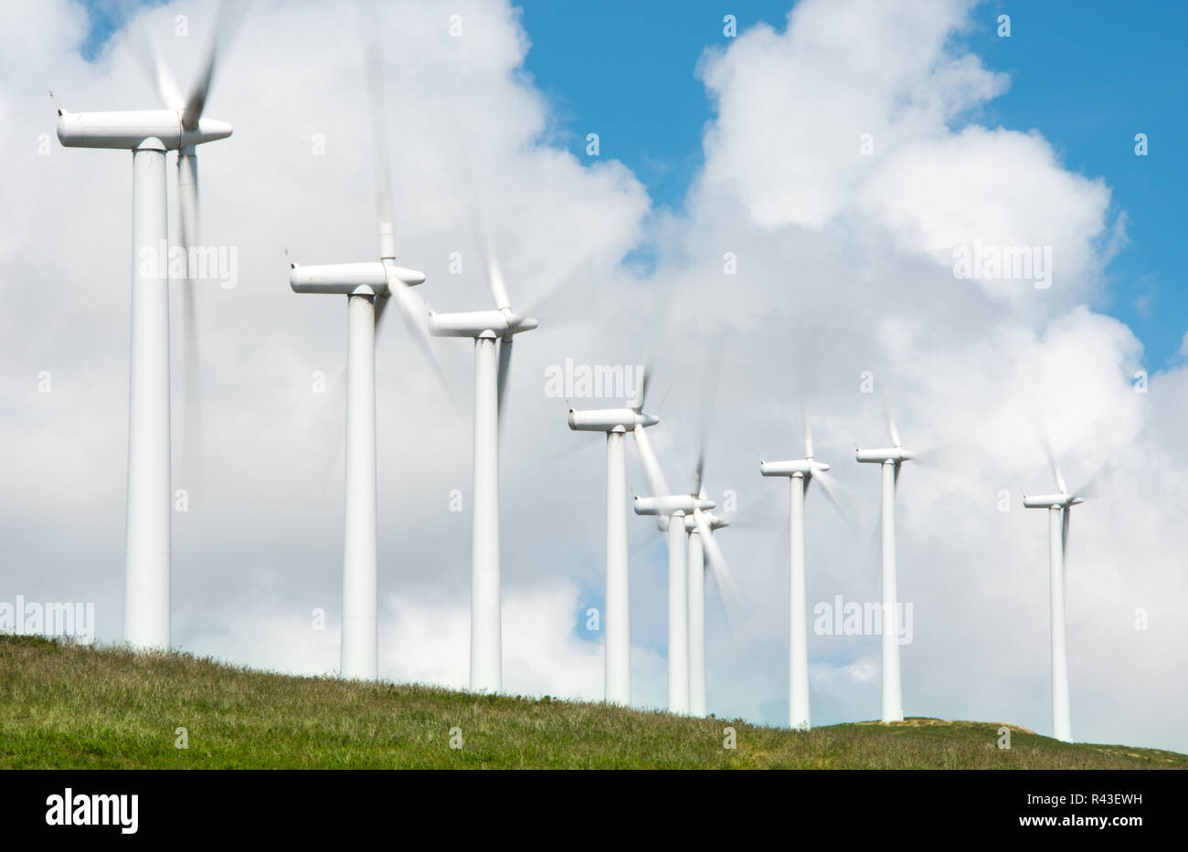 onshore wind turbines for electricity generation in wind farm Stock Photo