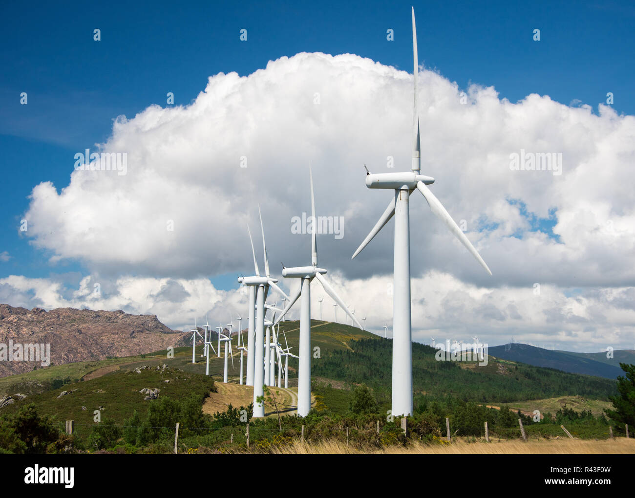 onshore wind turbines for electricity generation in wind farm Stock Photo