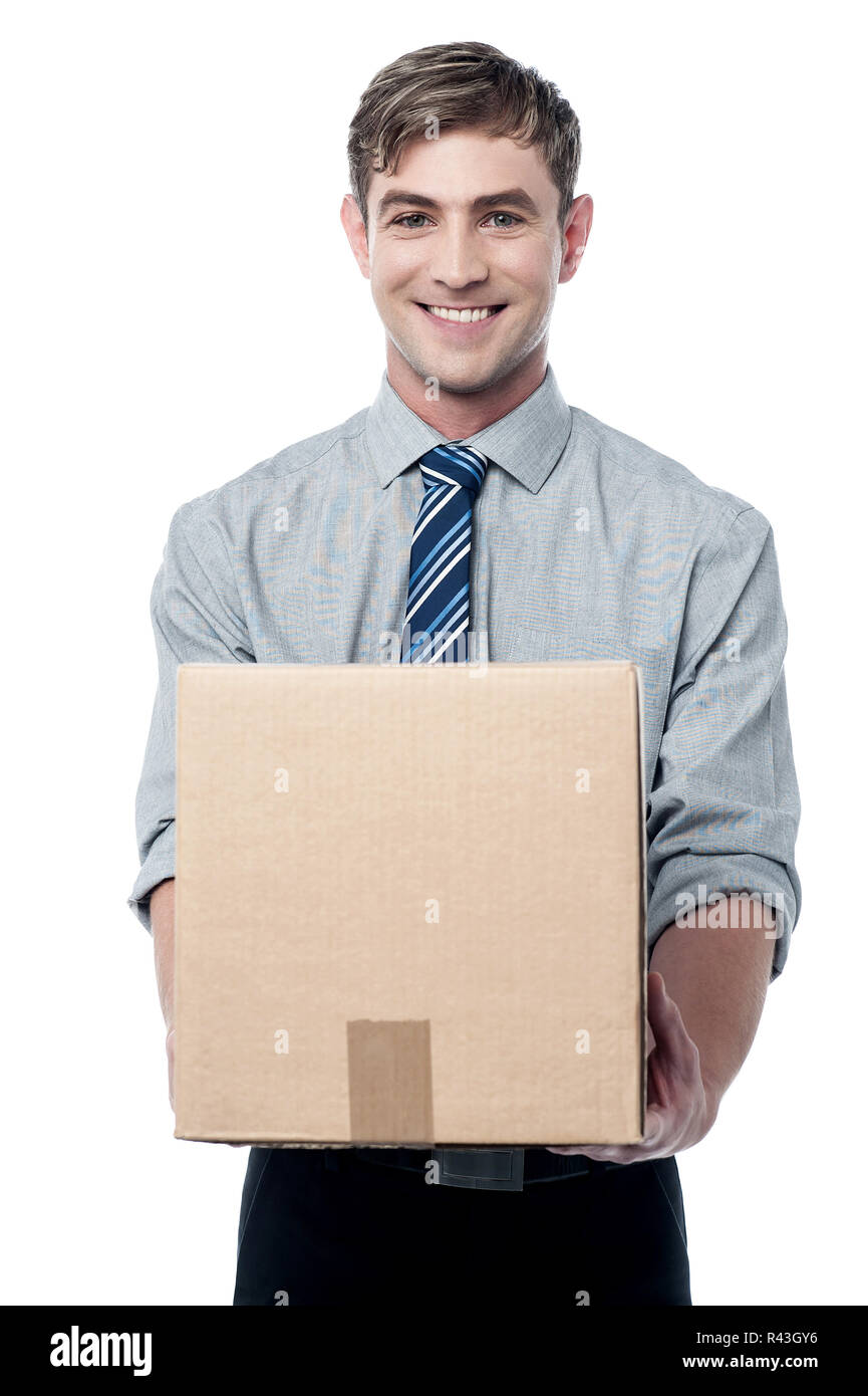 Handsome male executive with a package Stock Photo