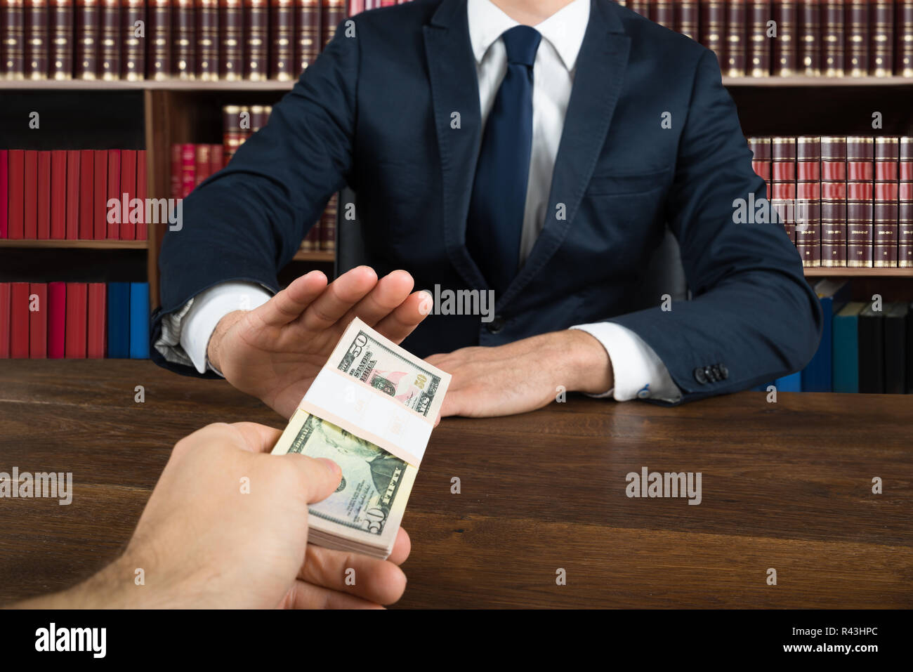 Lawyer Refusing To Take Bribe From Client At Desk Stock Photo Alamy