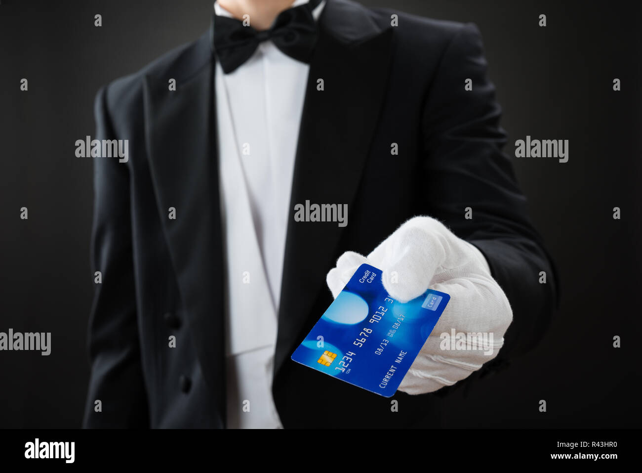 Midsection Of Waiter Holding Credit Card Stock Photo Alamy