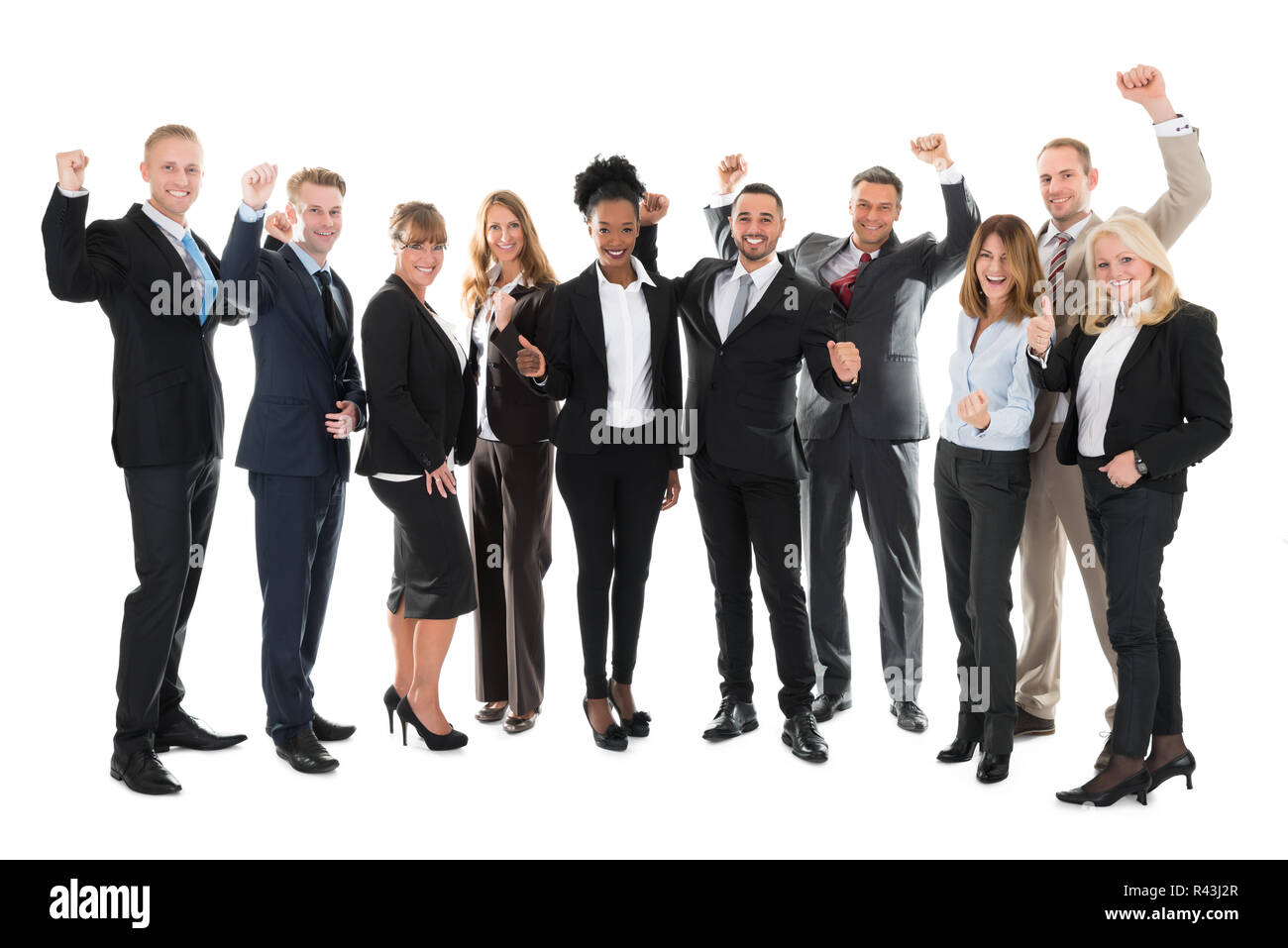 Full Length Of Happy Business Team Celebrating Success Stock Photo