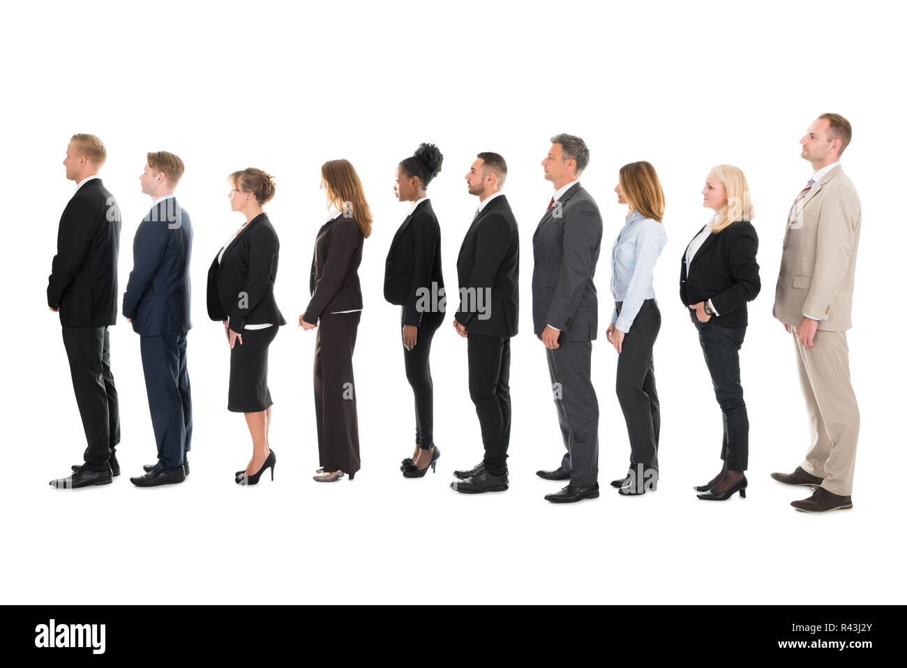 Side View Of Business Team Standing In Row Stock Photo