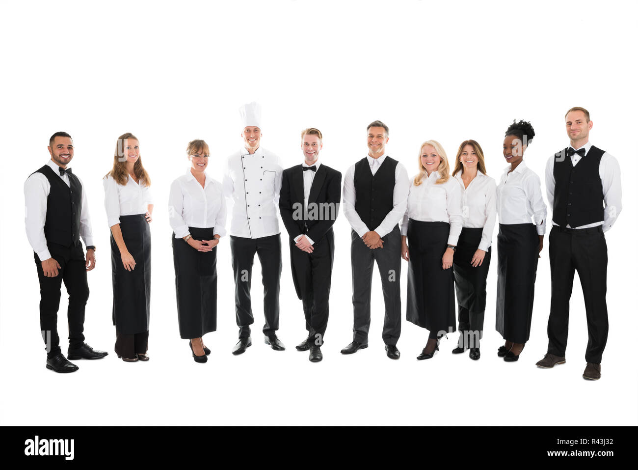 Portrait Of Confident Restaurant Staff Standing In Row Stock Photo