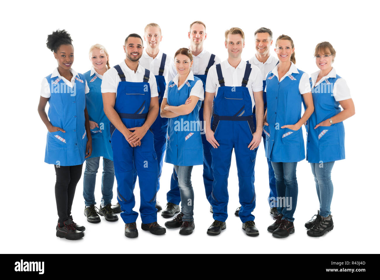 Group Portrait Of Confident Janitors Stock Photo