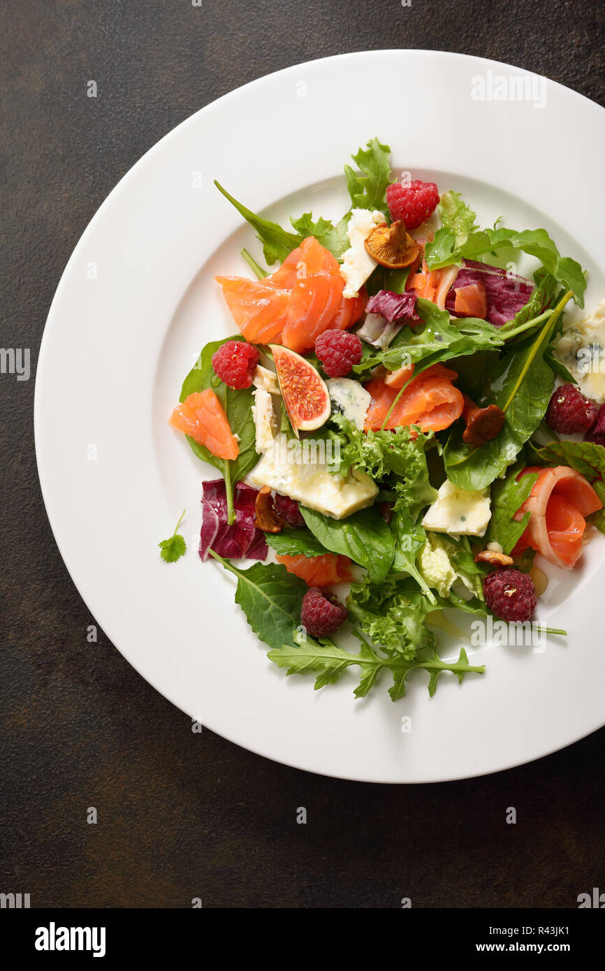 Fresh salad with salmon above Stock Photo - Alamy