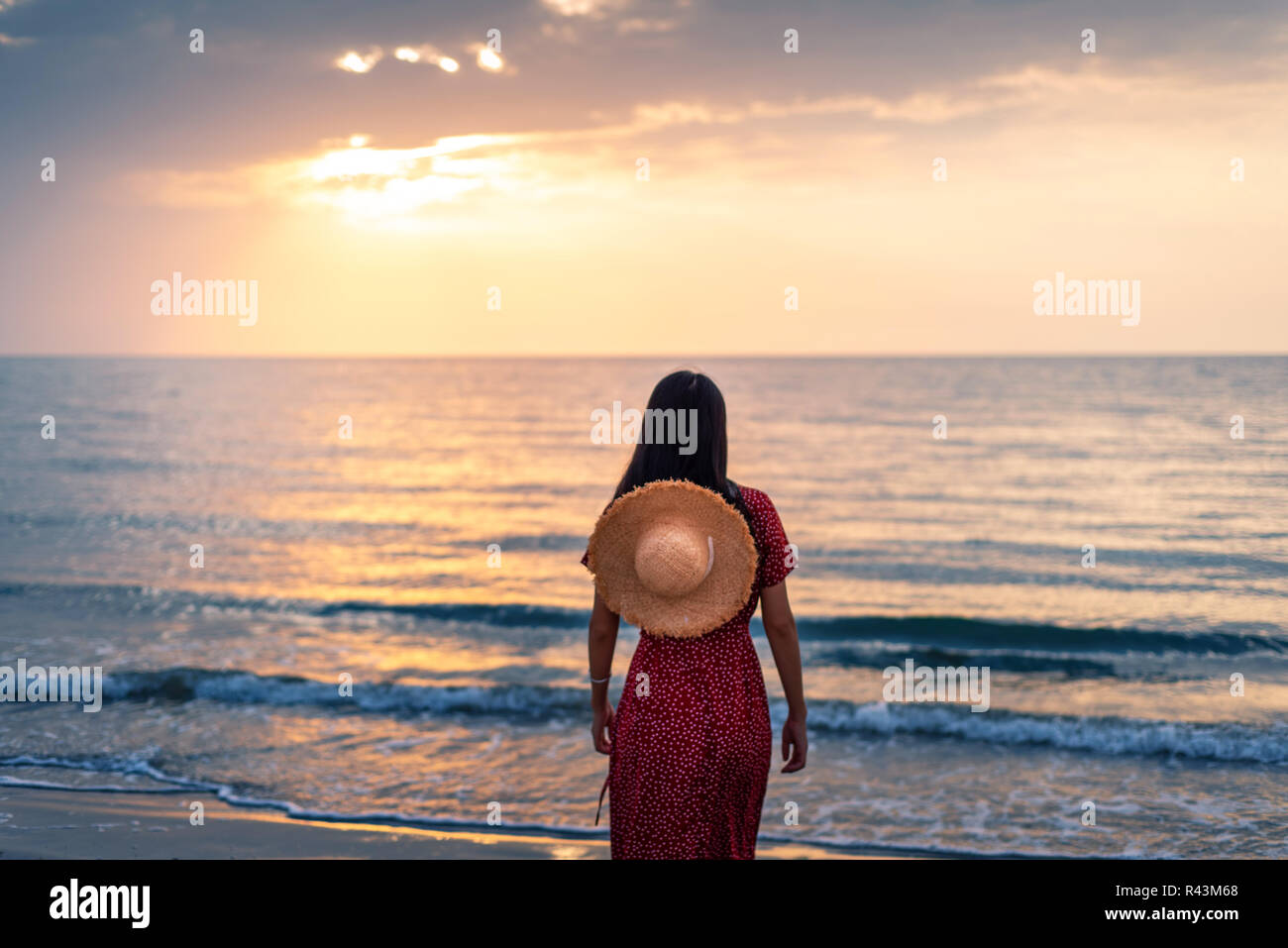 Woman walking tropical beach sunset hi-res stock photography and images ...